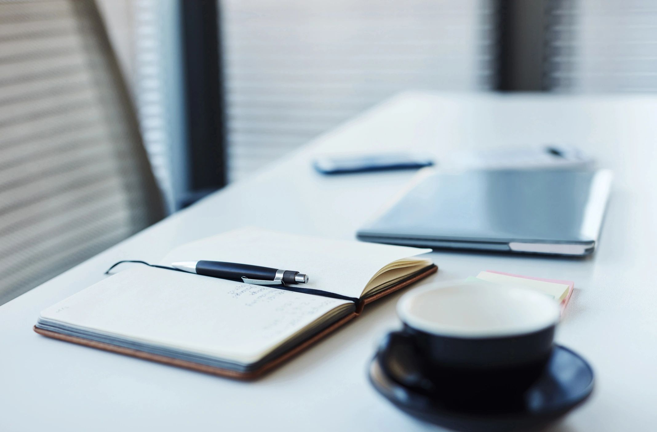 Professional accounting workspace with laptop and notebook