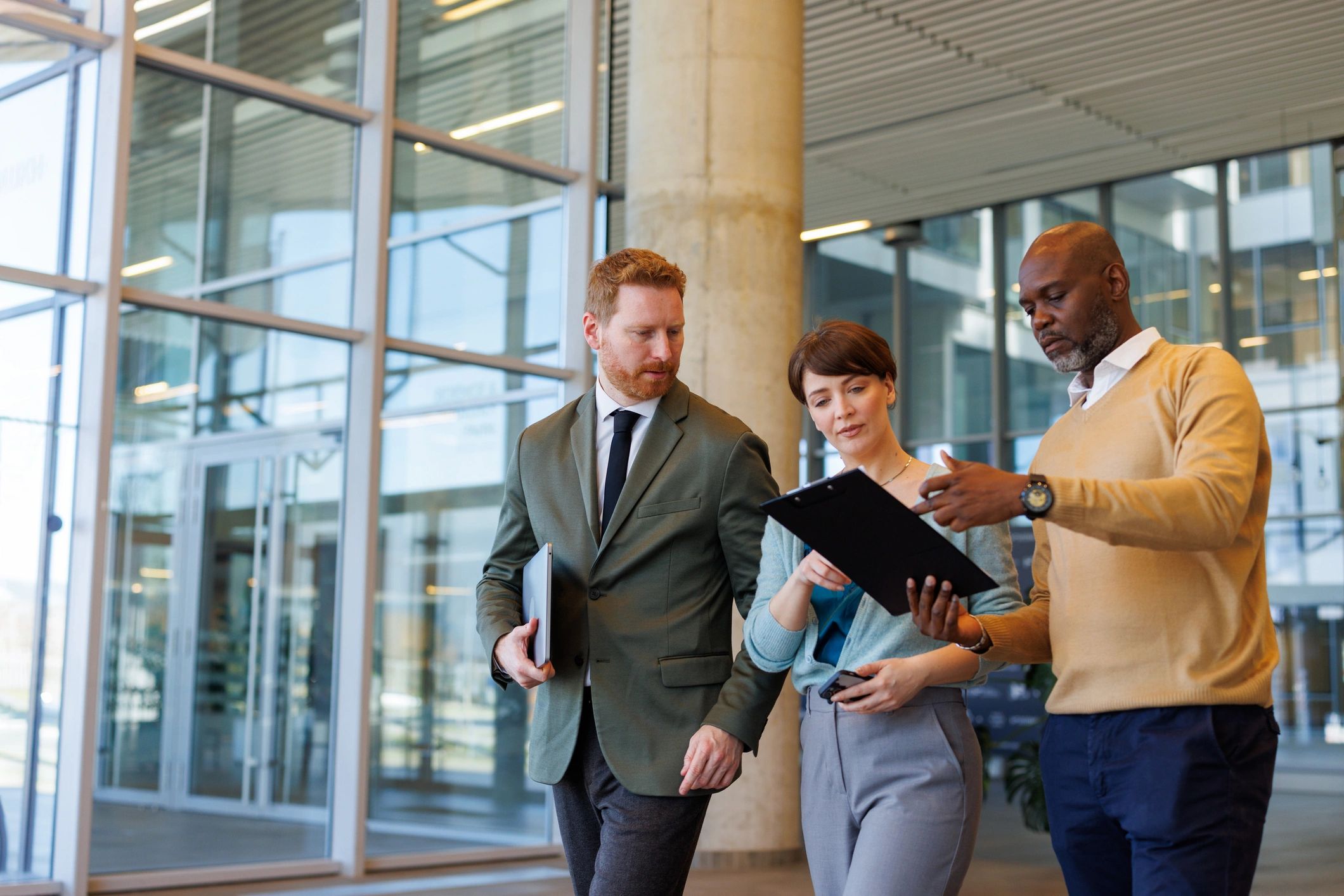 Business professionals discussing documents in an office